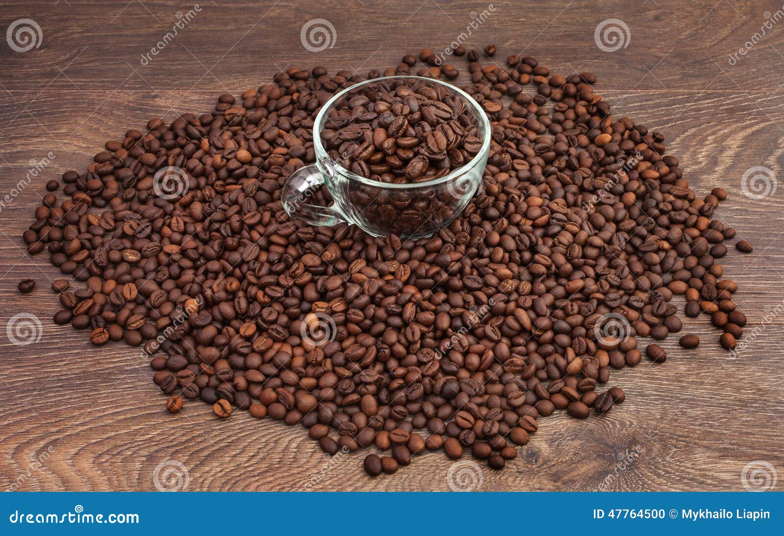 Tasty aromatic coffee beans in a glass cup