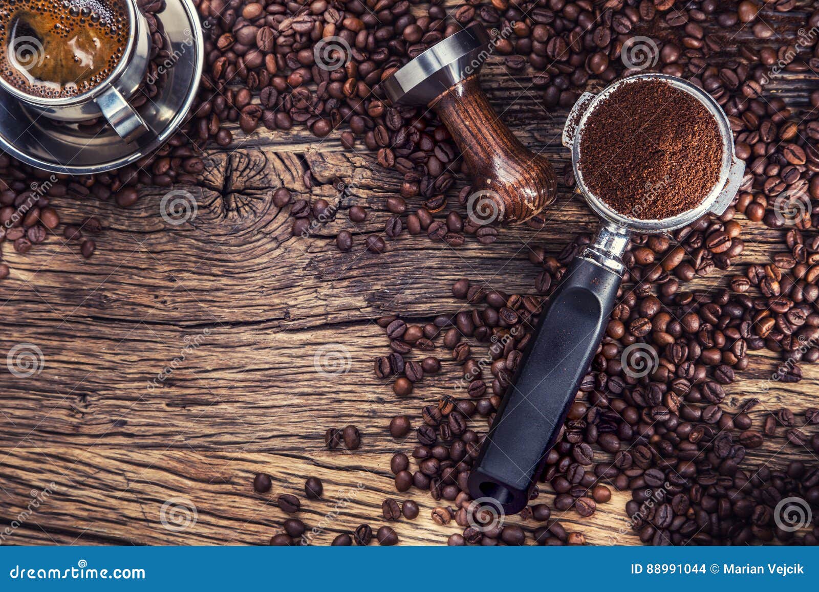 coffee. black coffee with coffee beans and portafilter on old oak wooden table
