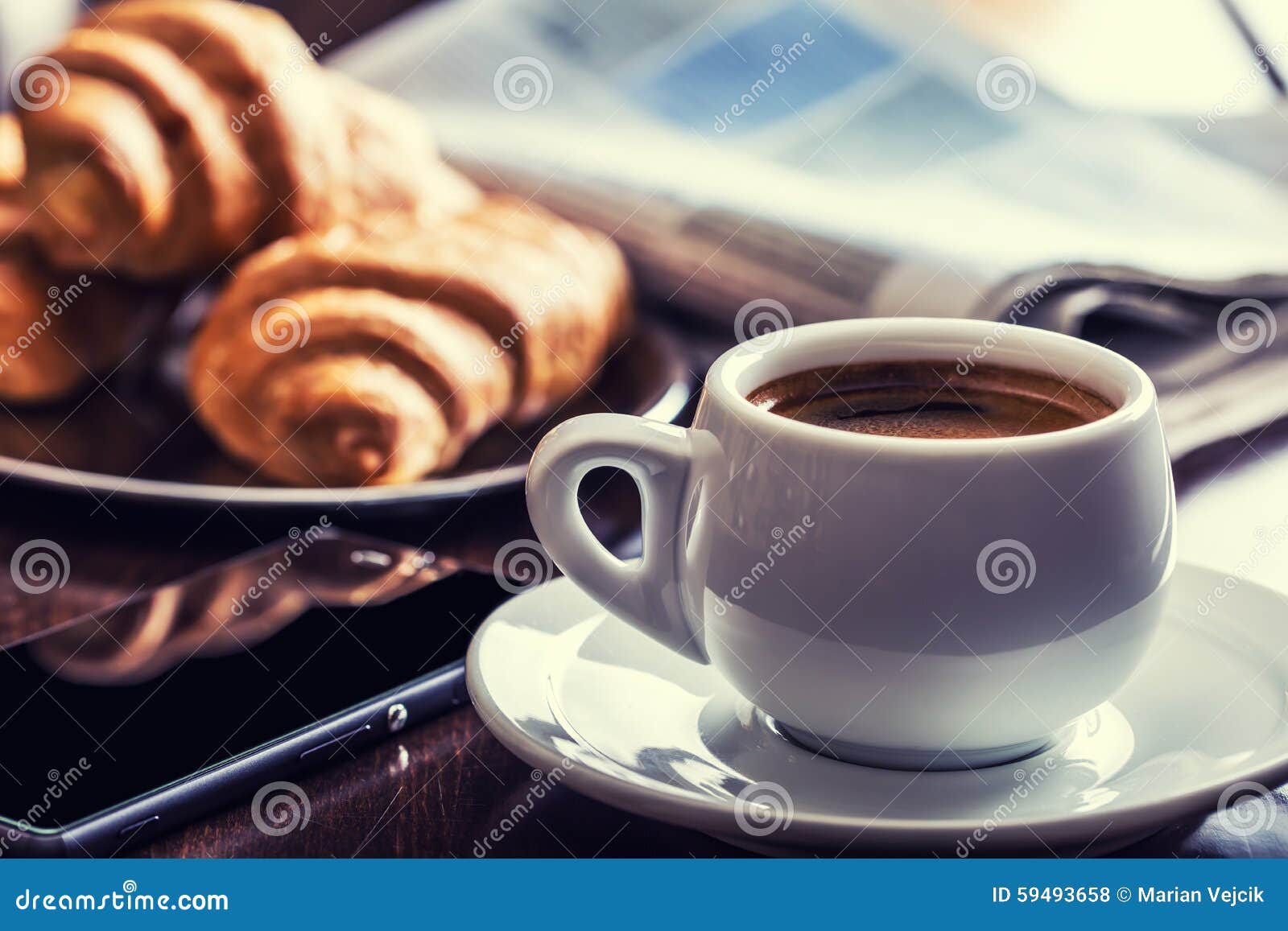 Coffee Break Business. Cup of Coffee Mobile Phone and Newspaper Stock