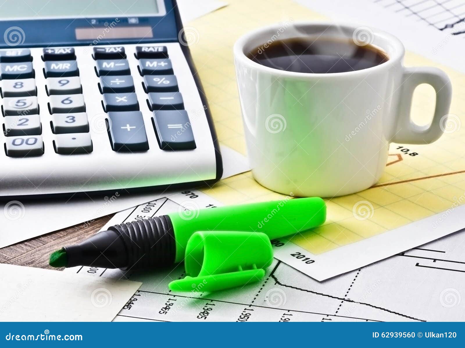 Coffee and Calculator on Paper Table with Diagram Stock Photo Image