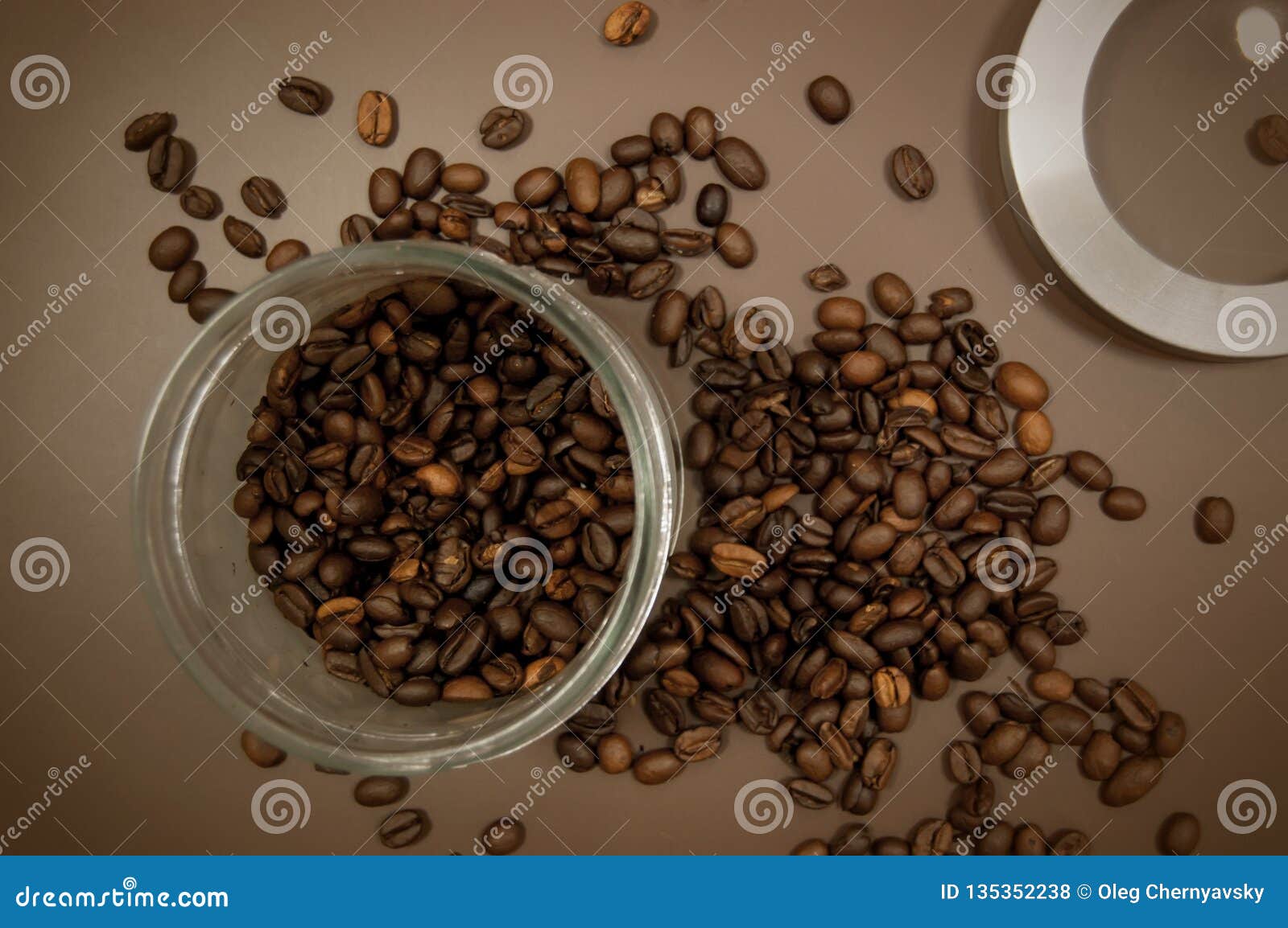 Coffee Canister Lid and Coffee Beans Scattered on the Table Stock Photo