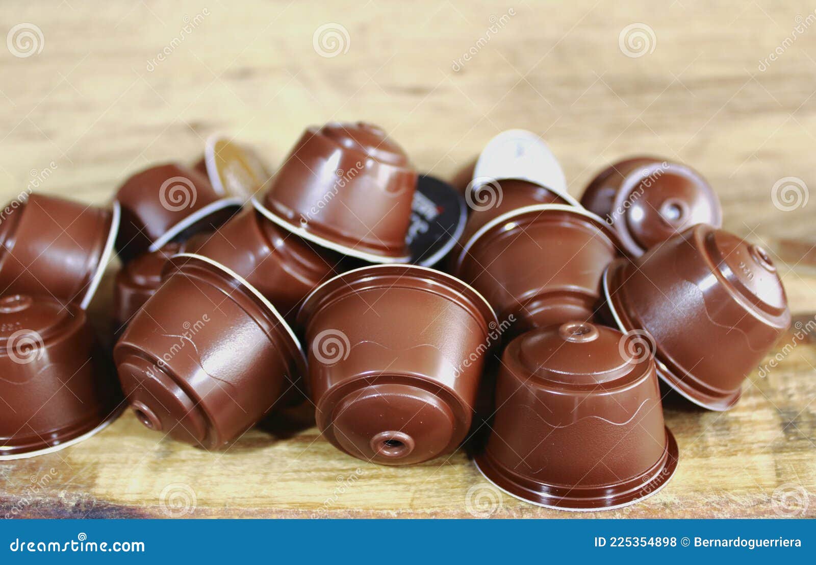 coffee capsules on brown wooden table for espresso machine