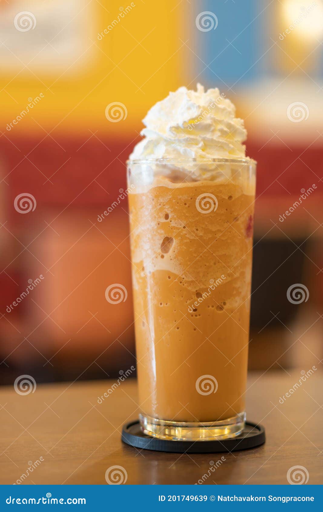 Coffee Caramel Frappe with Whipped Cream on Wood Table Stock Image