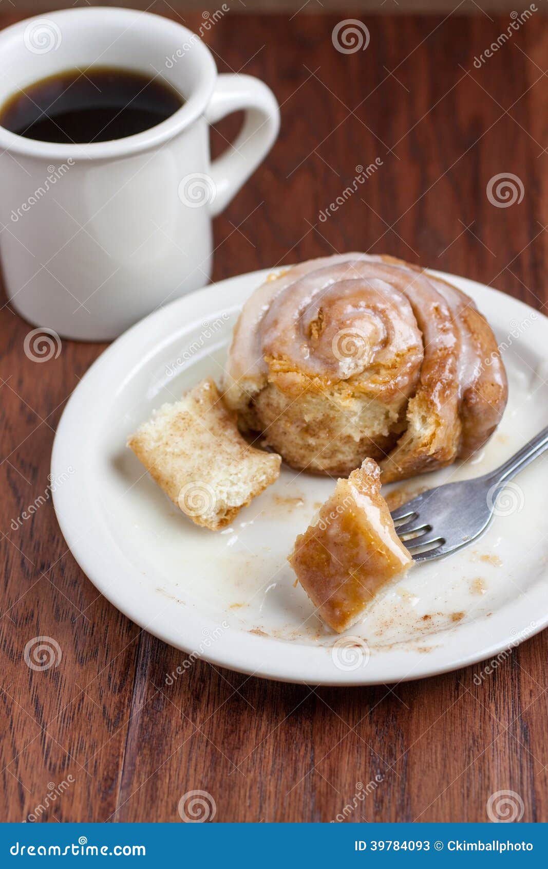 Coffee and Cinnamon Roll stock image. Image of plate 39784093