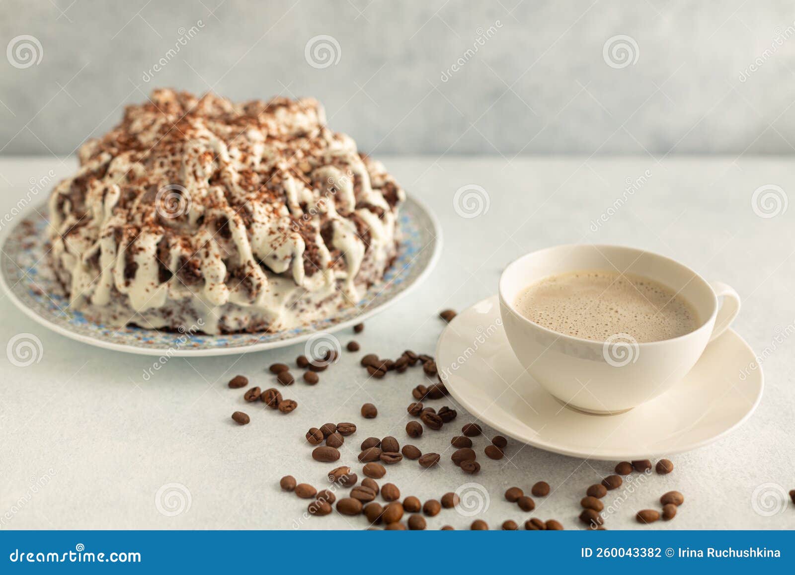 Coffee with Cream in a White Set with Coffee Beans, Cream Cake. Drink