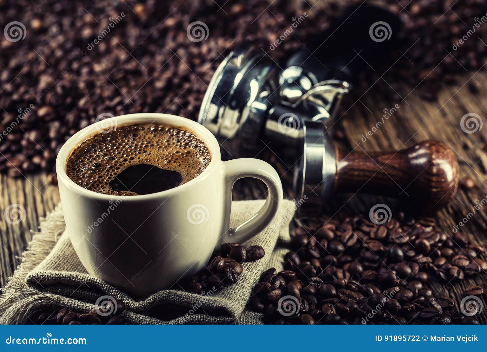 coffee. cup of black coffe with coffee beans tamper and portafilter