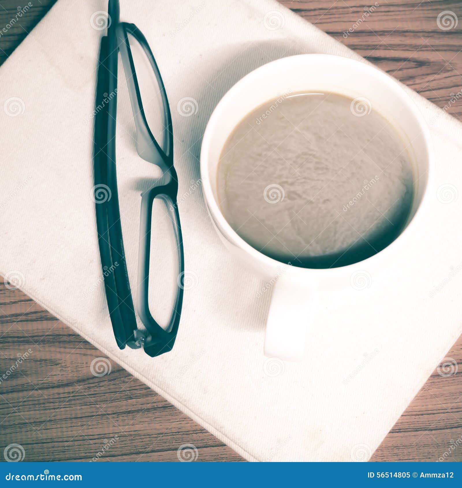 coffee cup and notebook with glasses