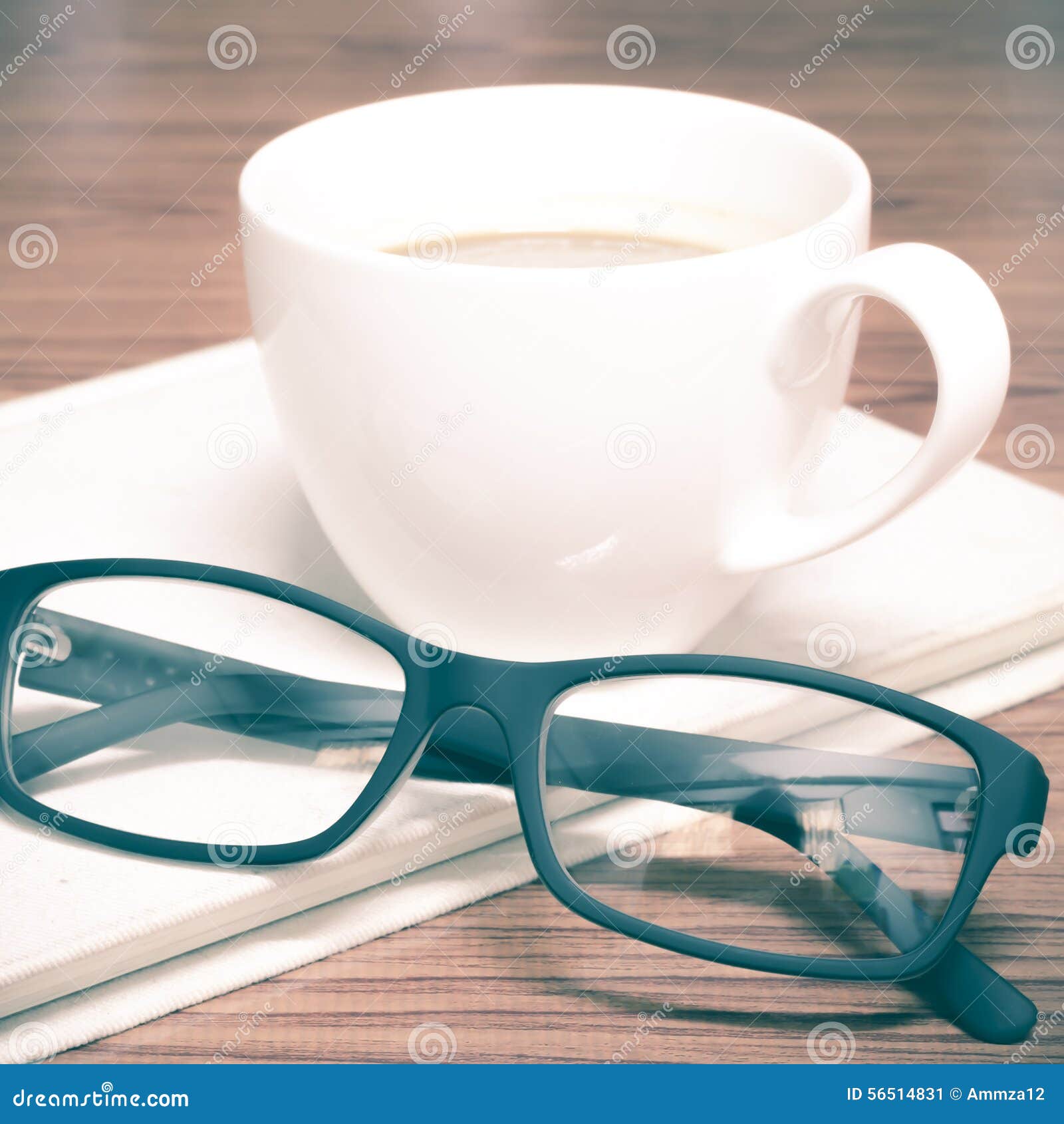 coffee cup and notebook with glasses