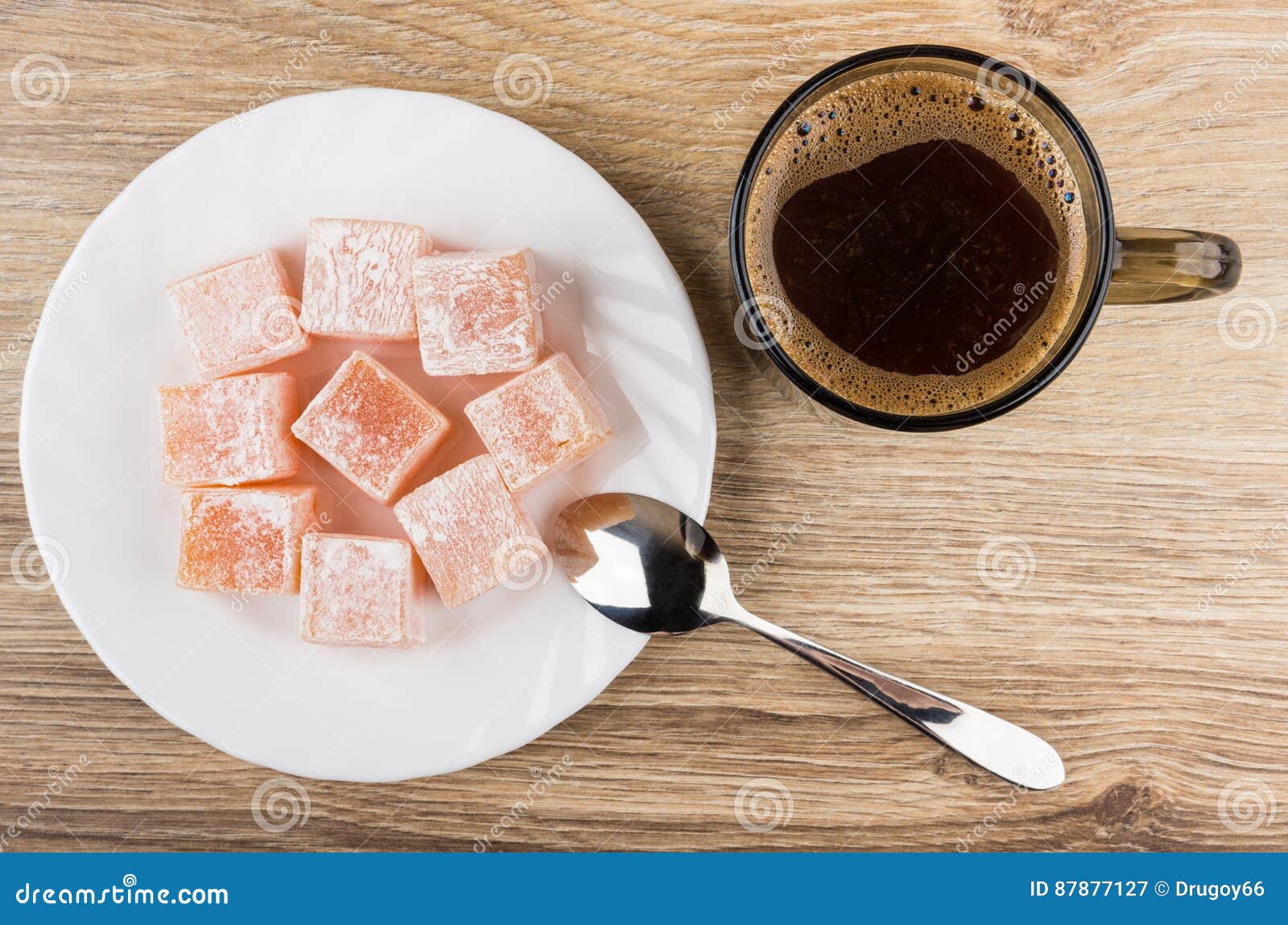 Coffee Cup, Rakhat-lukum on Plate and Spoon on Table Stock Image ...