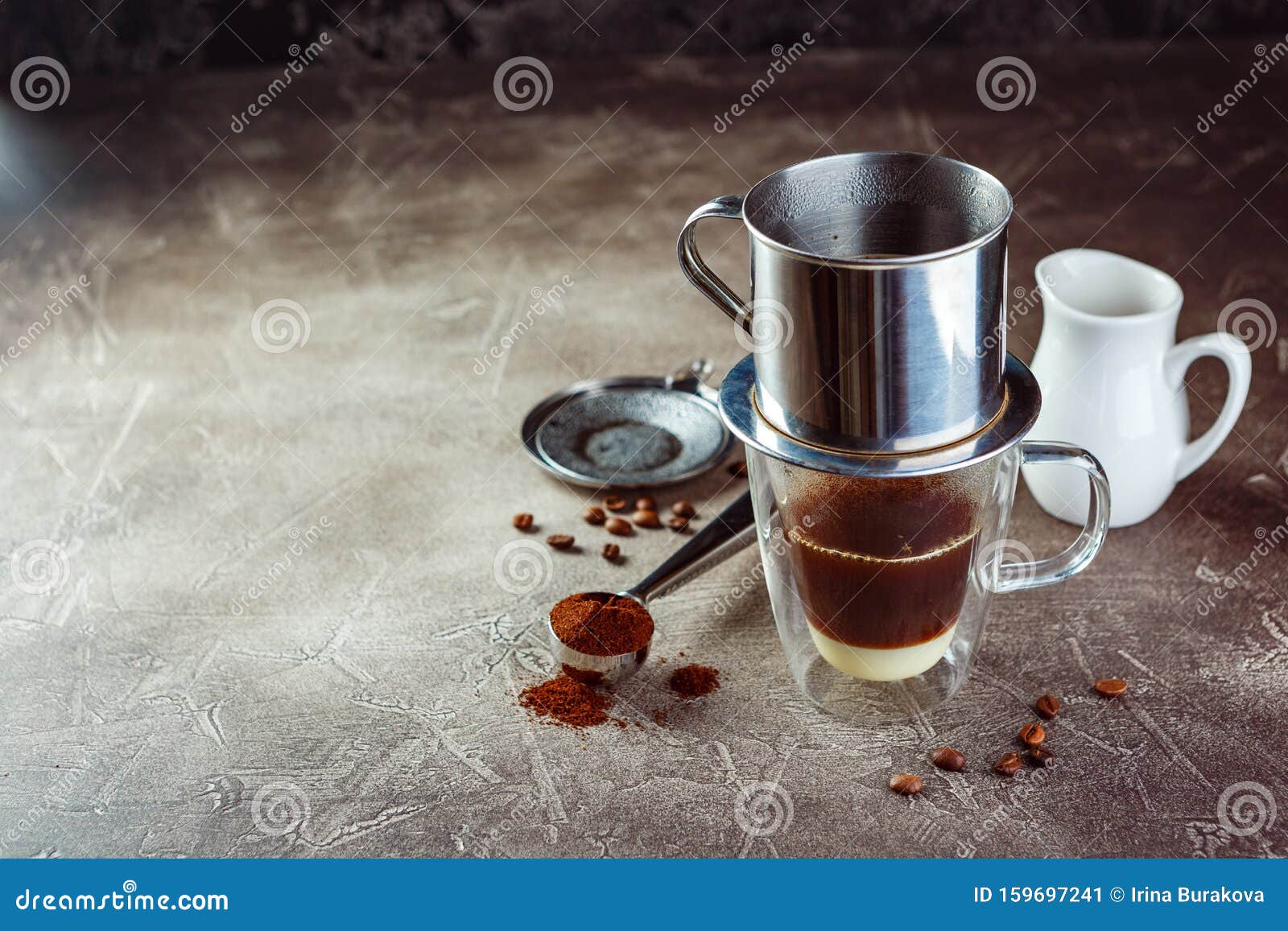 Vietnamese coffee in glass cups, traditional metal coffee maker phin. Black drip  coffee as famous in Vietnam 25499474 Stock Photo at Vecteezy