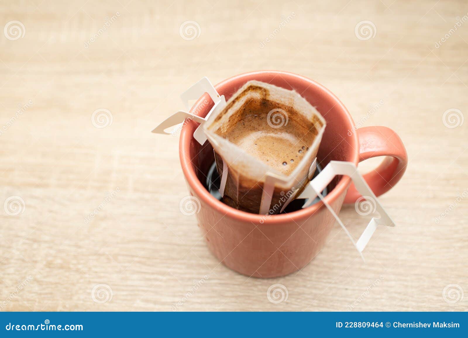 Coffee Drips in Cup. Alternative Brewing Coffee in Paper Filter Bags
