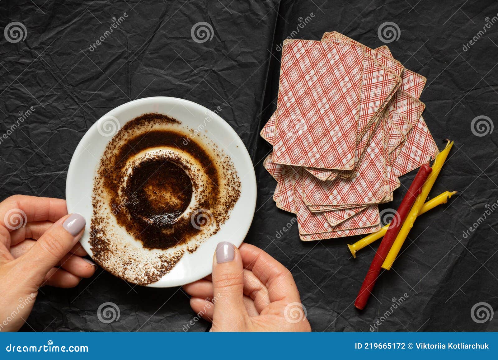 Coffee Grounds in the Hands of a Fortune Teller and Cards and Candles