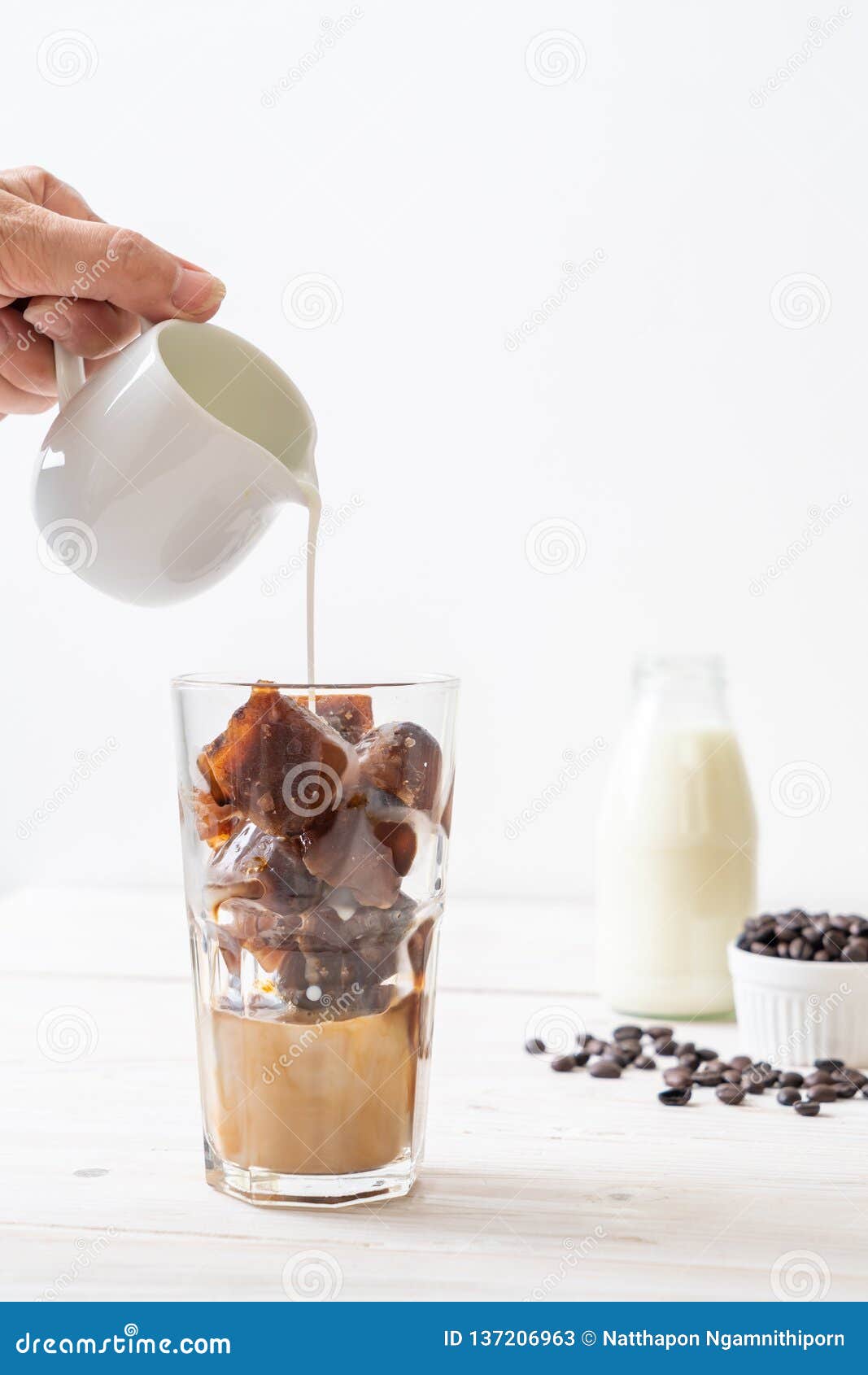 Coffee ice cubes with milk stock image. Image of iced 137206963
