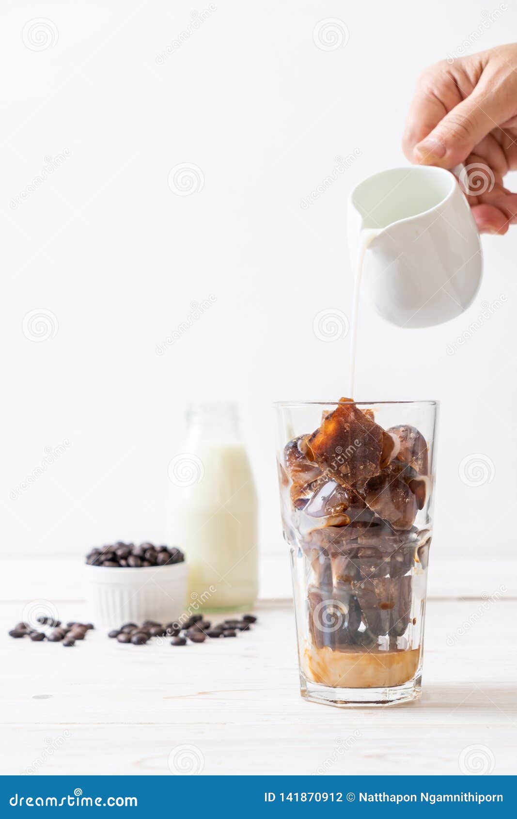 Coffee ice cubes with milk stock photo. Image of beverage 141870912