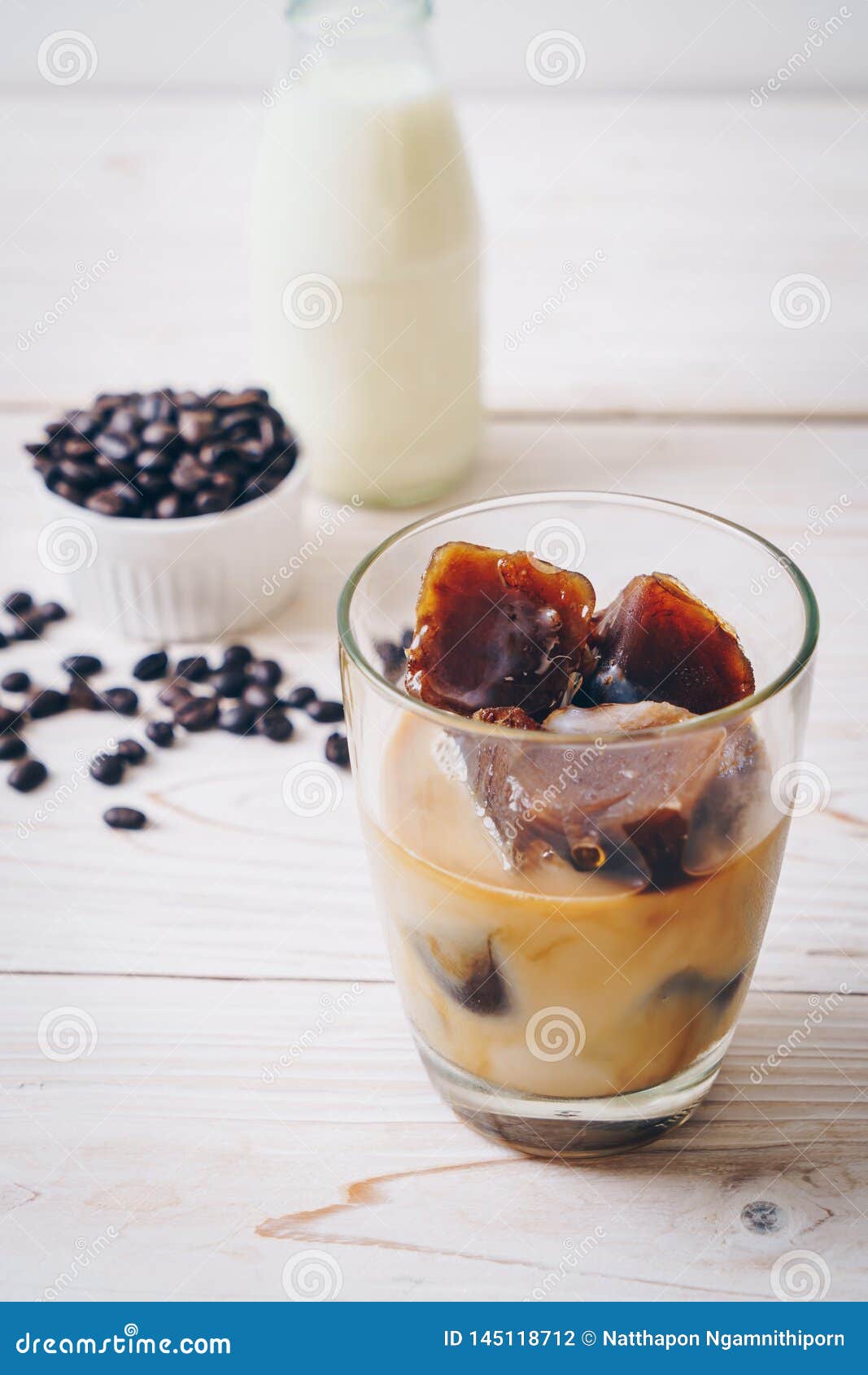 Coffee ice cubes with milk stock photo. Image of frozen 145118712
