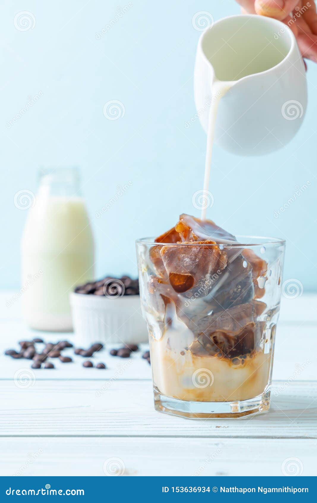 Coffee ice cubes with milk stock photo. Image of black 153636934