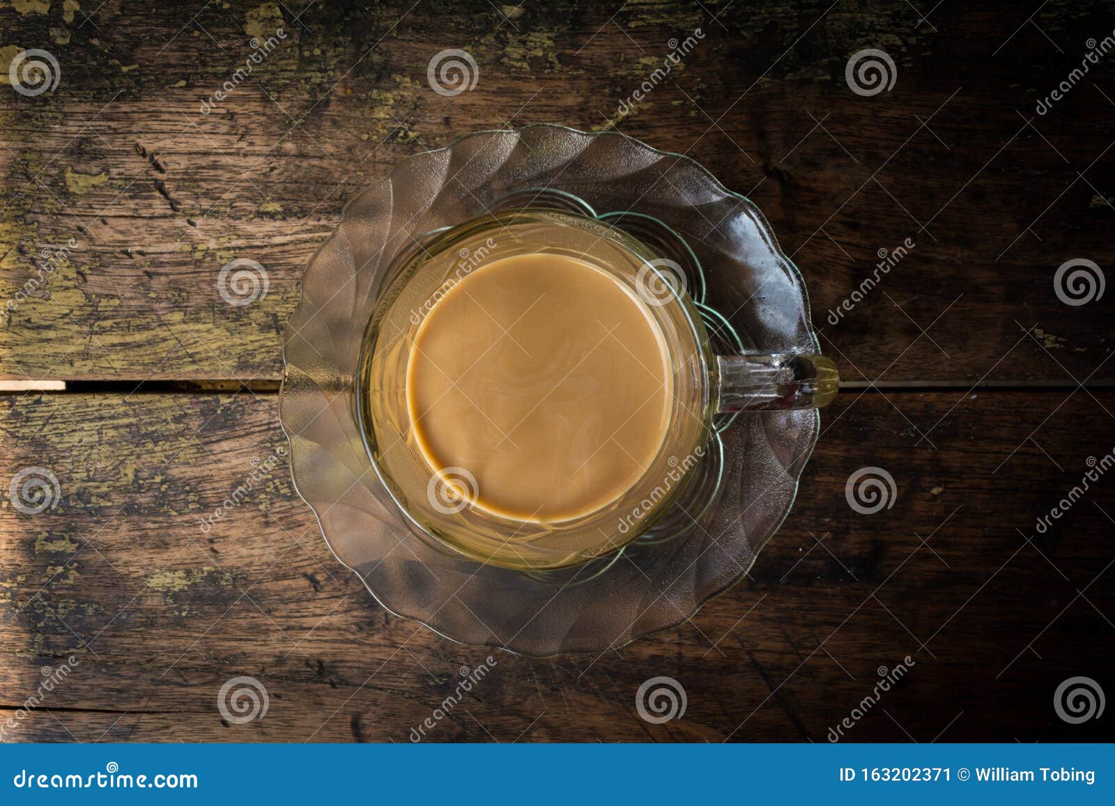 coffee latte in glass mug isolated wood background