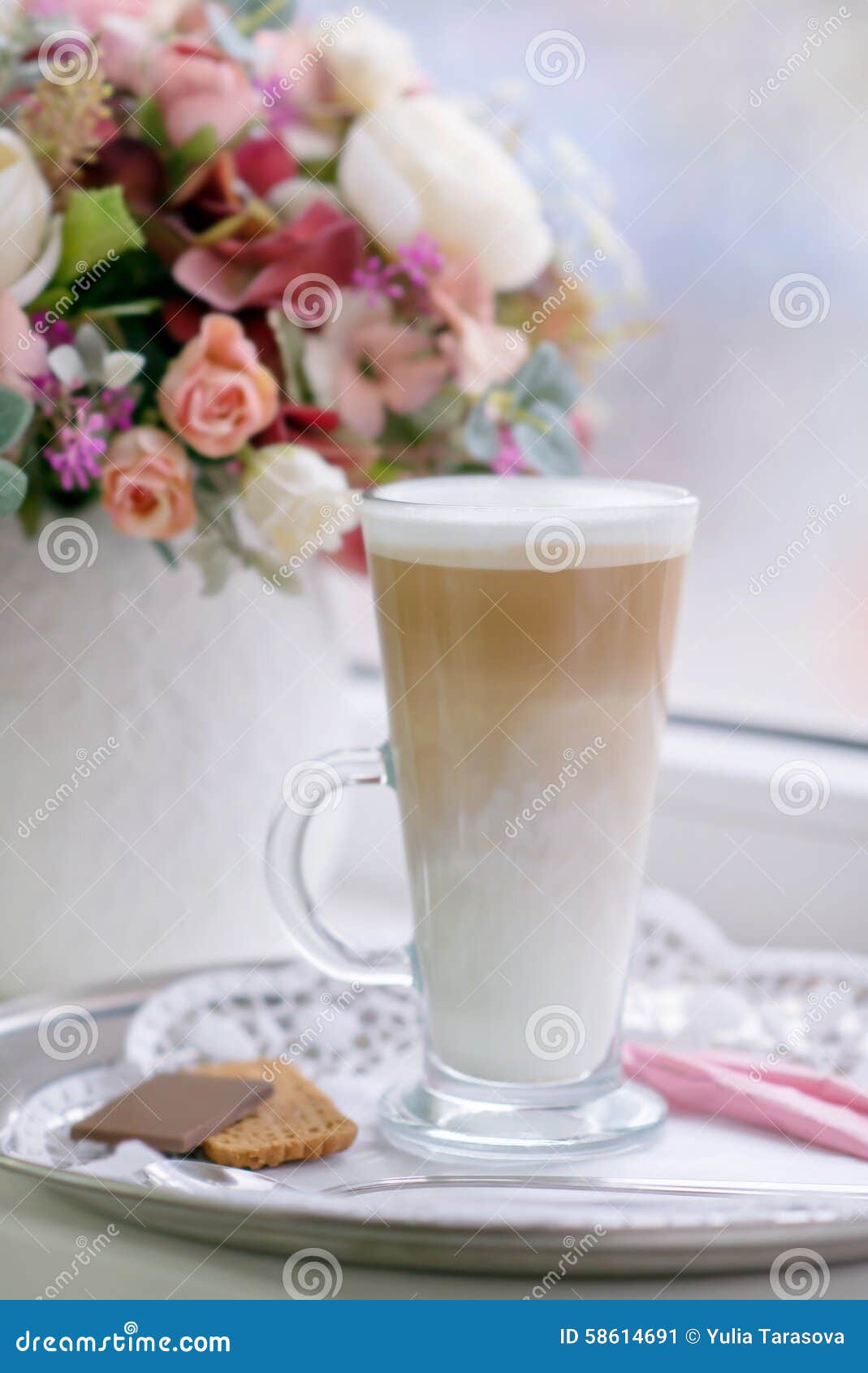 coffee latte in transparent glass silver in cafe, latte macchiat