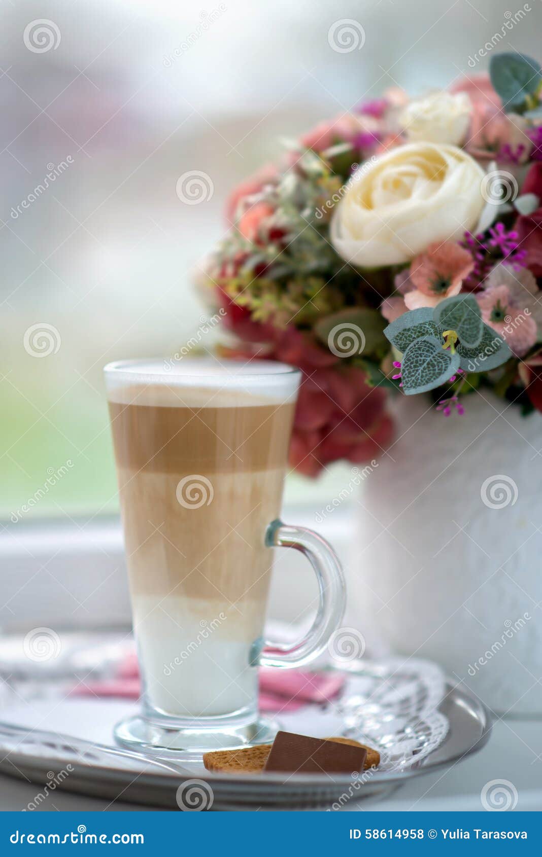 coffee latte in transparent glass silver in cafe, latte macchiat