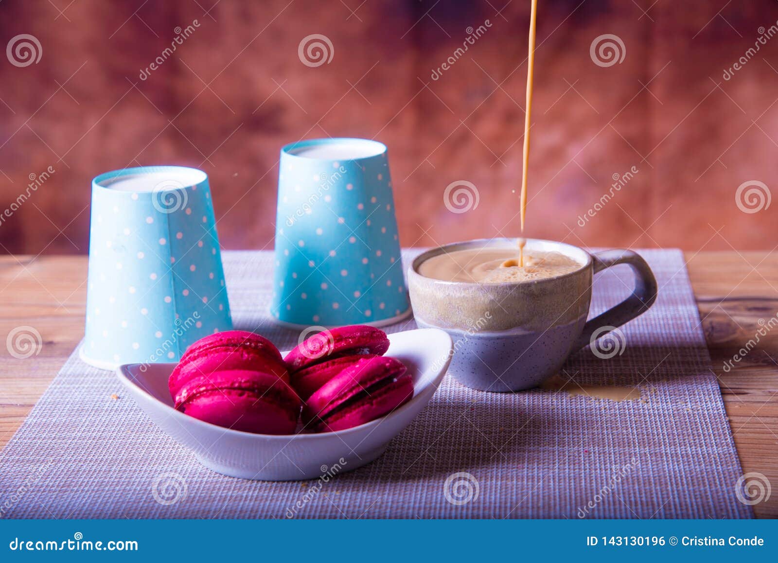 coffee milk and cookies on brown background