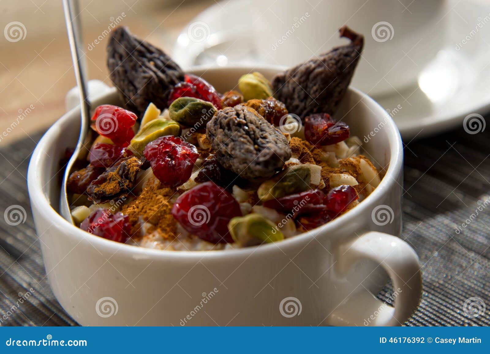 Coffee and Oatmeal with Fruit and Nuts Breakfast Setting Stock Photo
