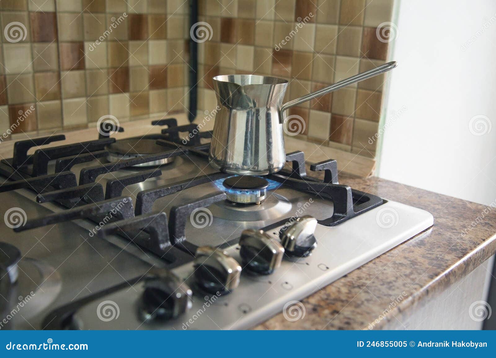 Coffee pot on gas stove stock image. Image of flame 246855005
