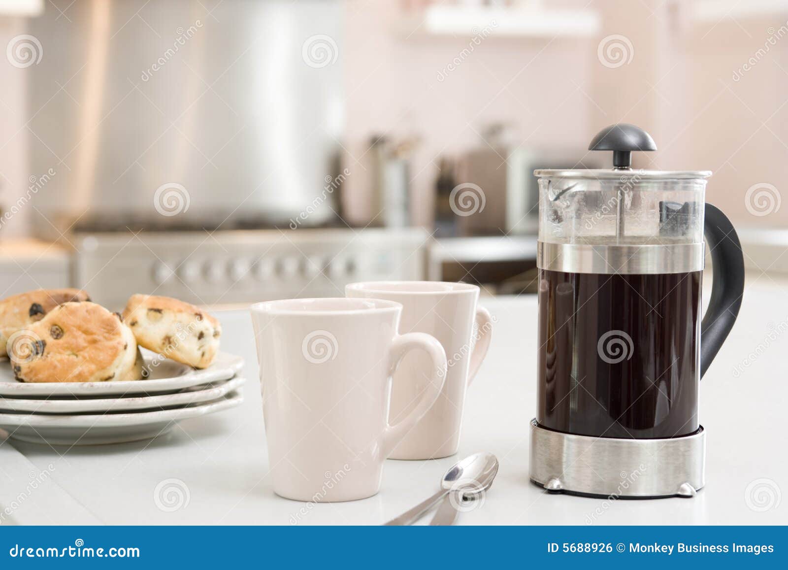 coffee pot on kitchen counter with scones