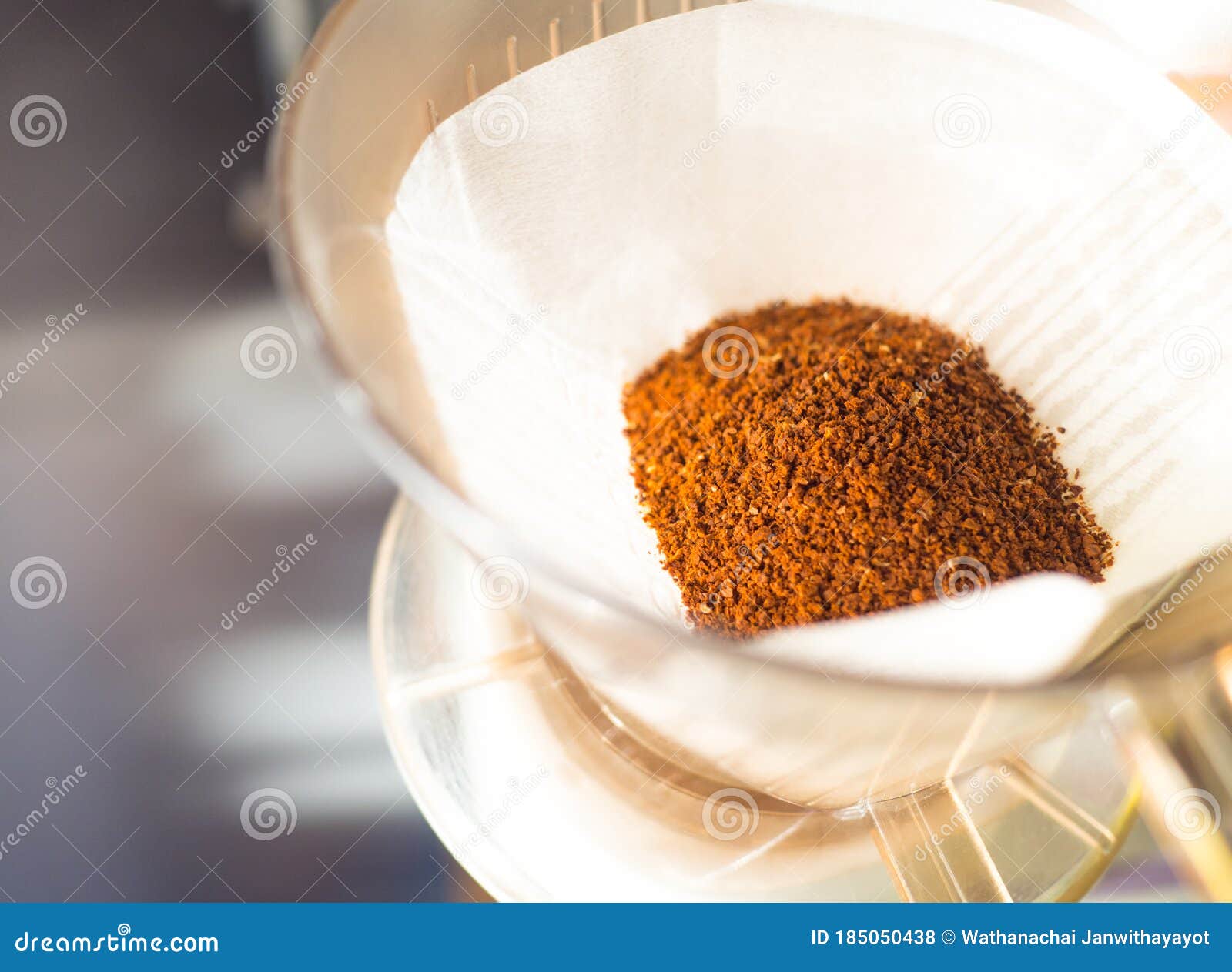 coffee powder obtained by grinding on filter paper and cups for dripping coffee