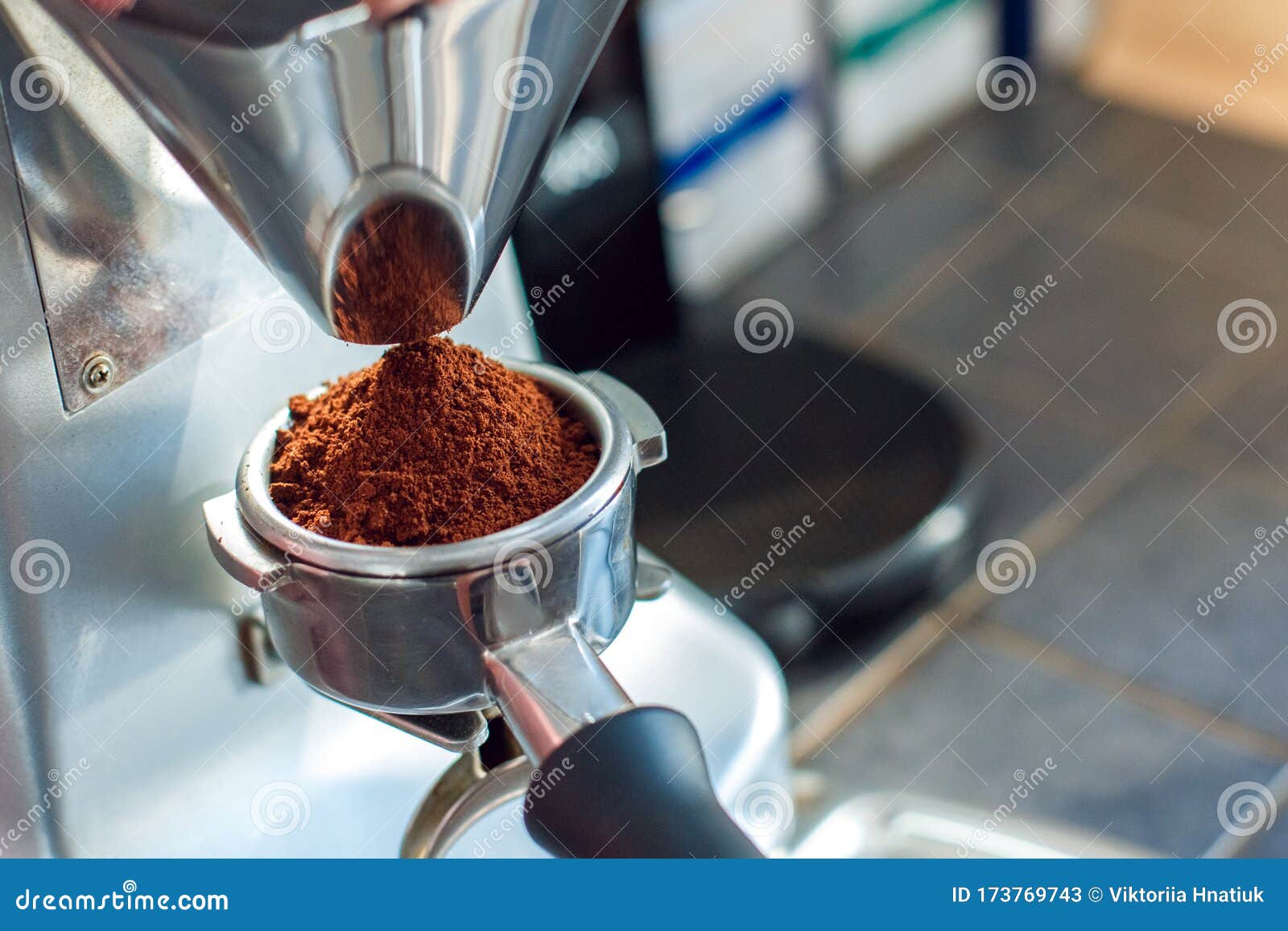Coffee Shop. Barista Grinding Coffee Using Eletric Grinder Closeup