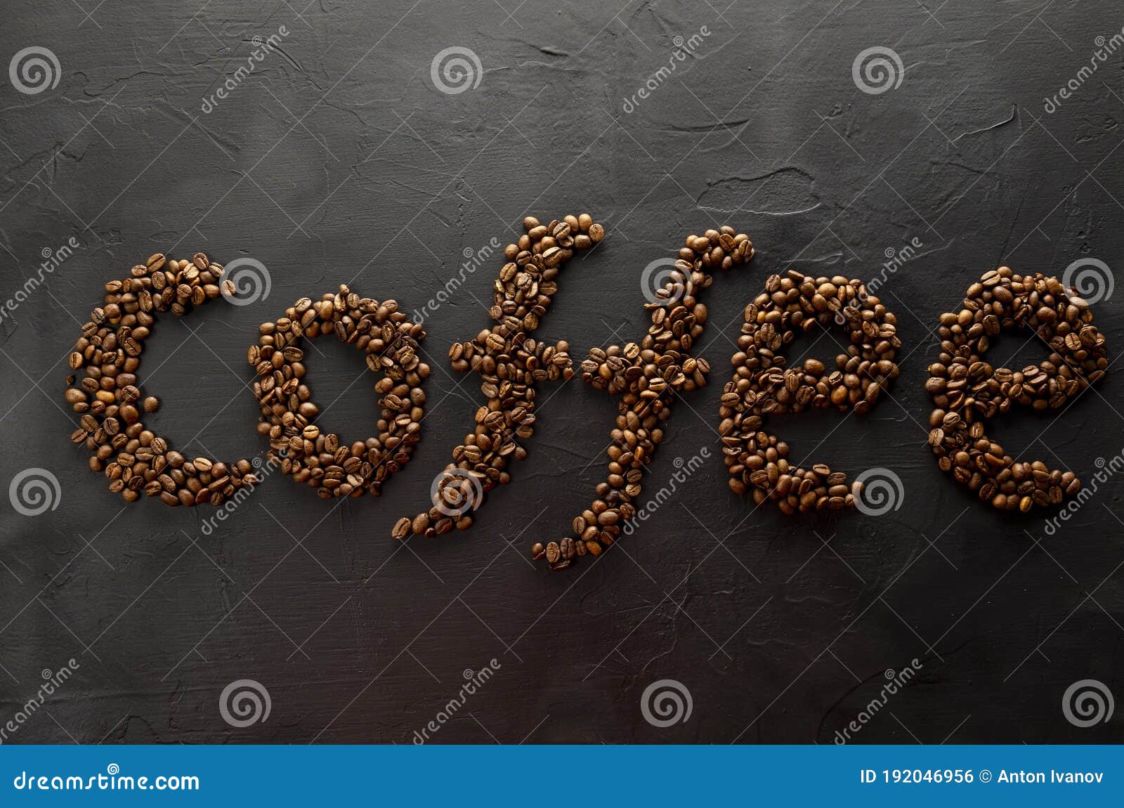 Coffee Word Lined with Coffee Beans on a Dark Background Stock Photo