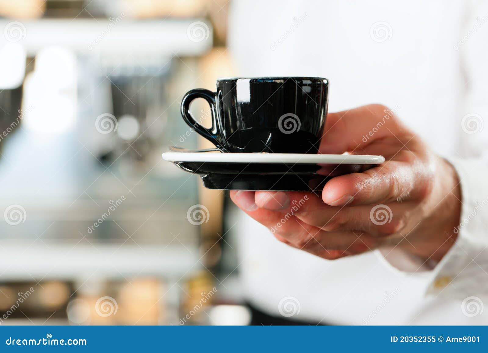 coffeeshop - barista presents coffee or cappuccino
