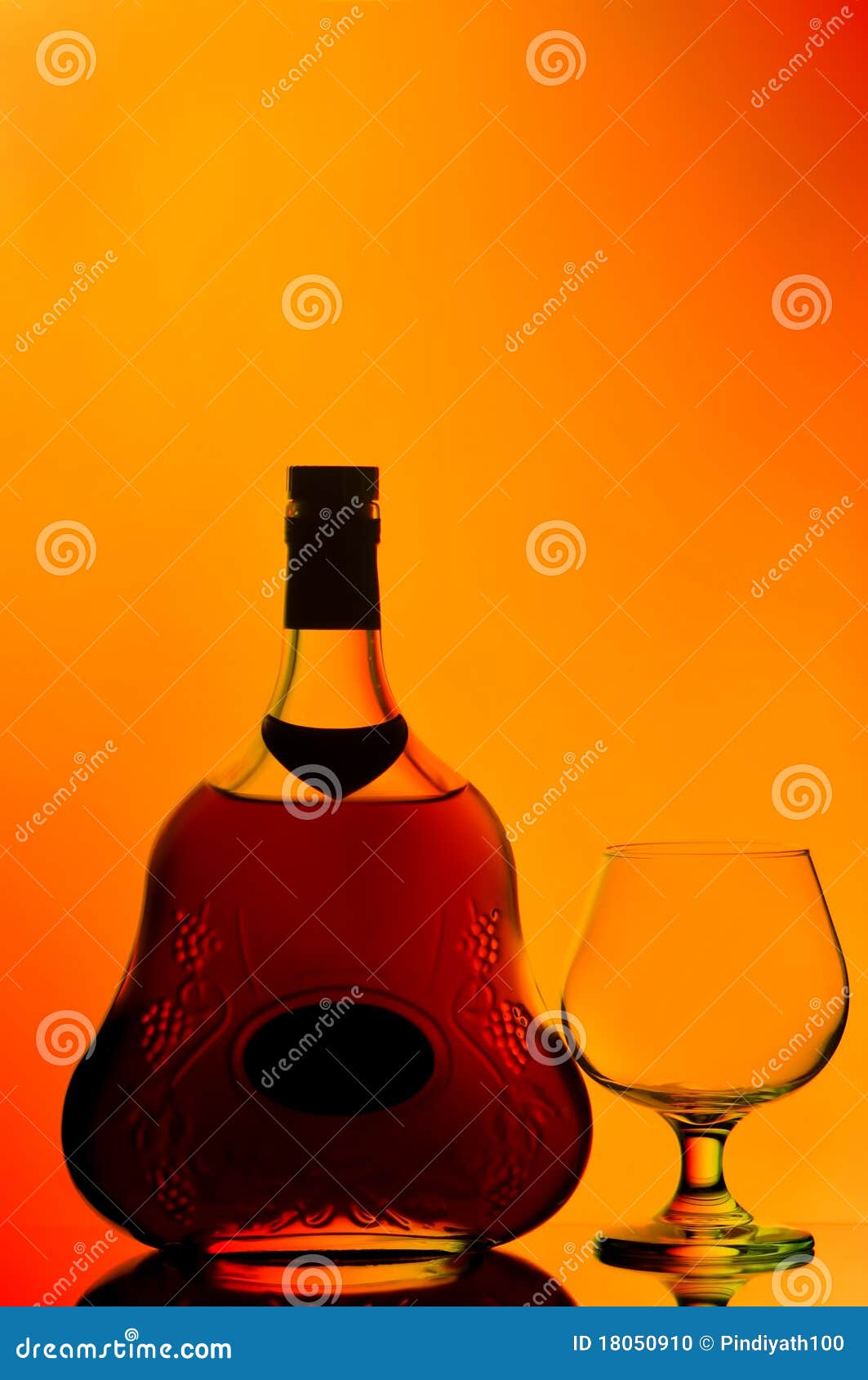 Cognac bottle and glass stock photo. Image of spirits 18050910