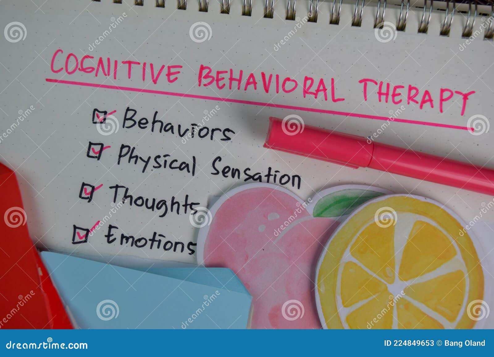 cognitive behavioral therapy write on a book with keywords  on wooden table. chart or mechanism concept