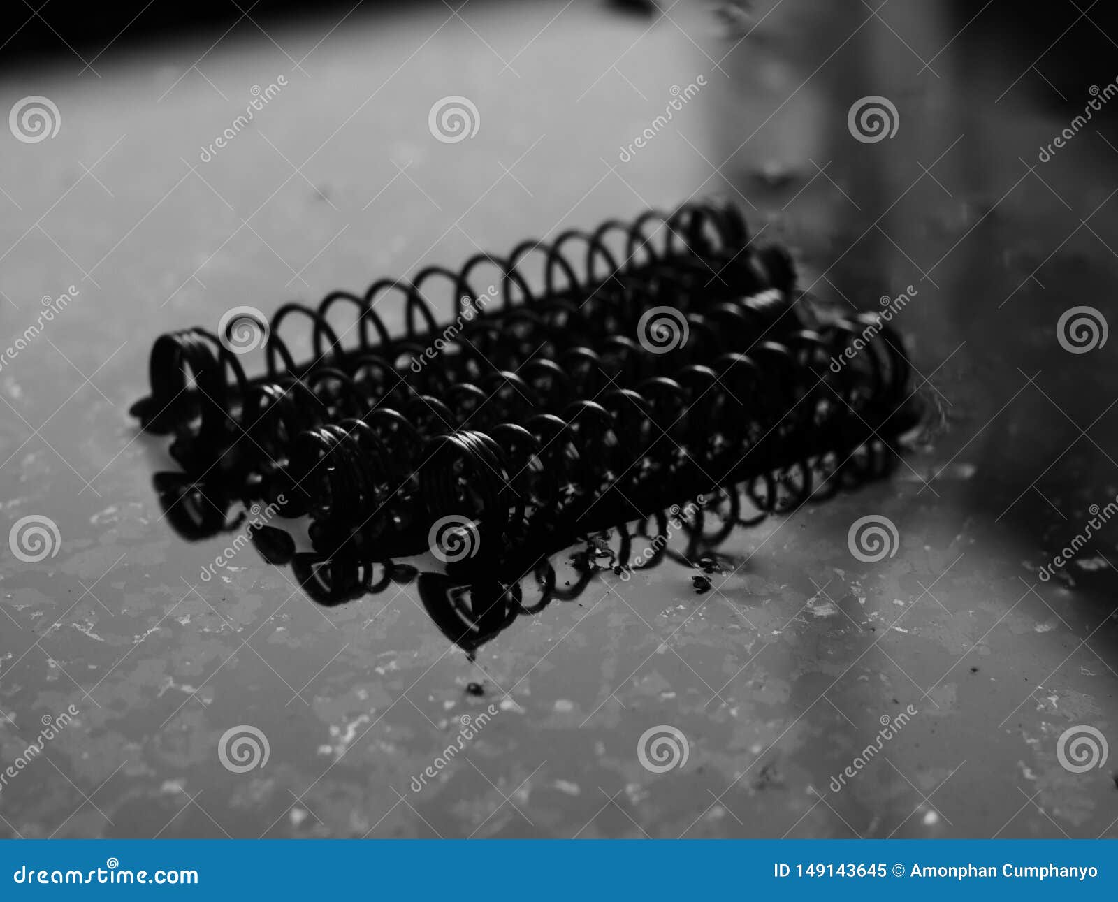 A Coil Spring from a Ballpoint Pen on Abstract Background Stock Image