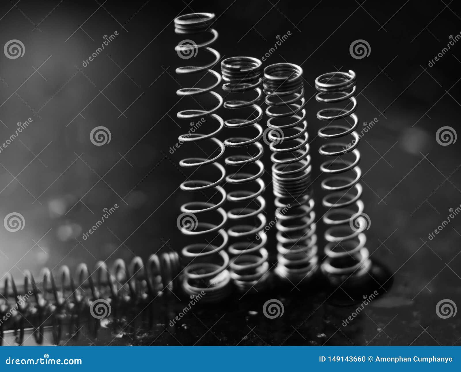 A Coil Spring from a Ballpoint Pen on Abstract Background Stock Photo