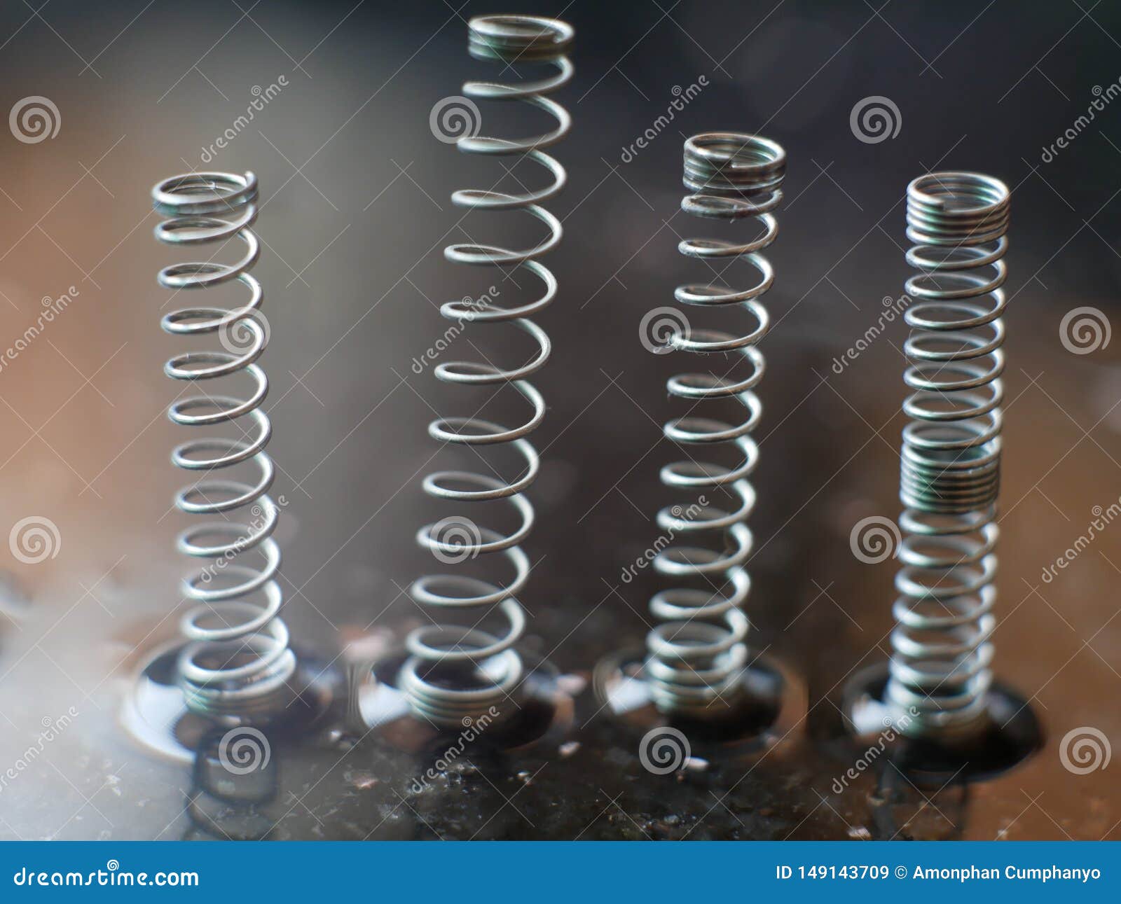 A Coil Spring from a Ballpoint Pen on Abstract Background Stock Image