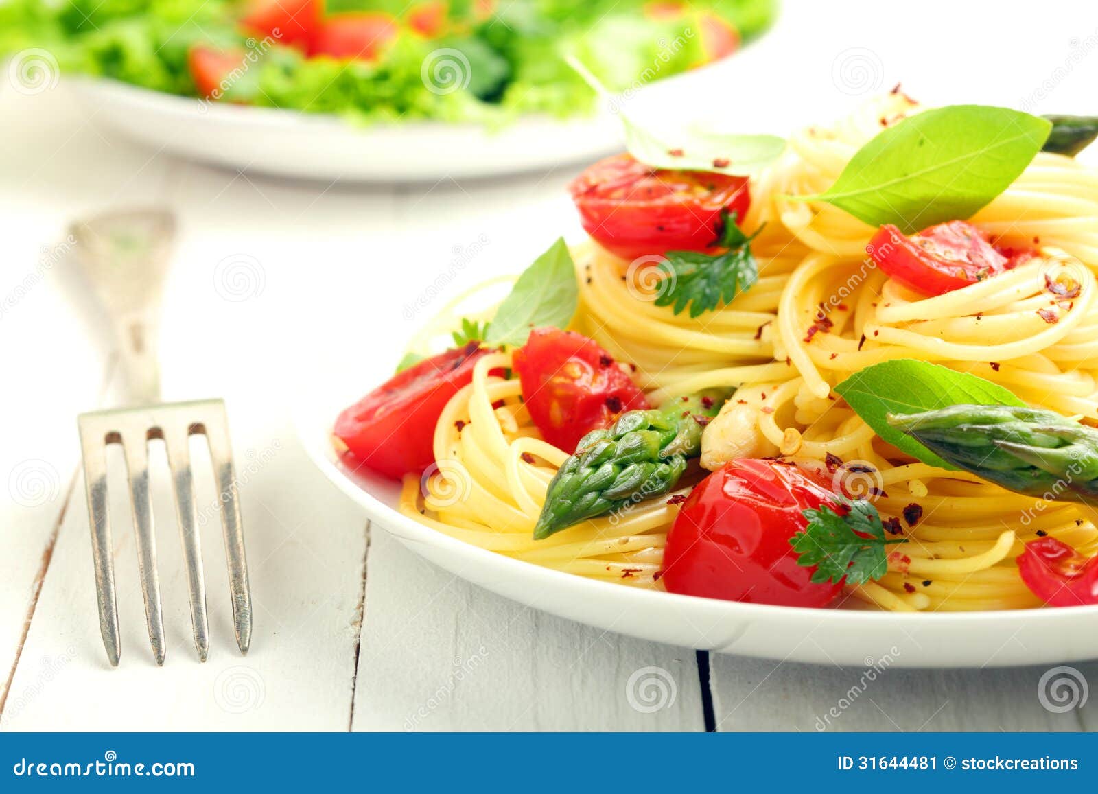 coiled spaghetti with tomato and basil