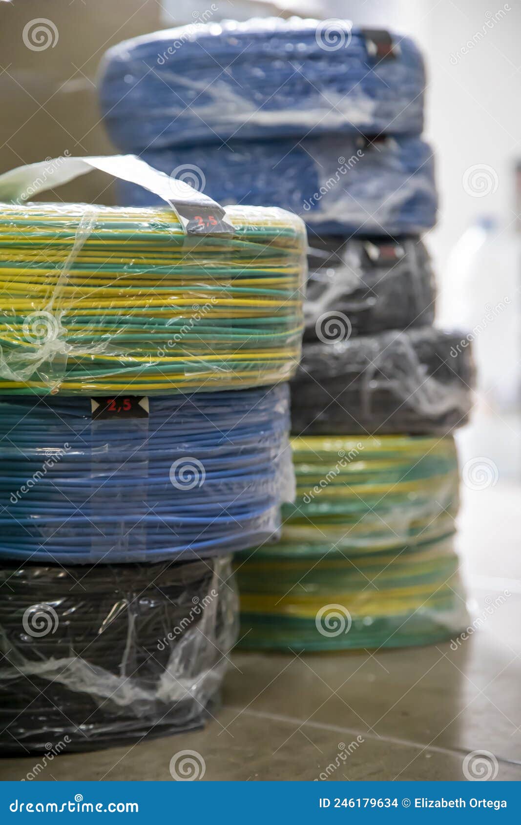 coils of electrical cable of various colors on the floor
