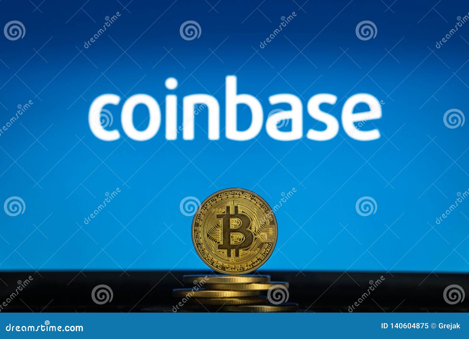 Coinbase Logo On A Computer Screen With A Stack Of Bitcoin ...