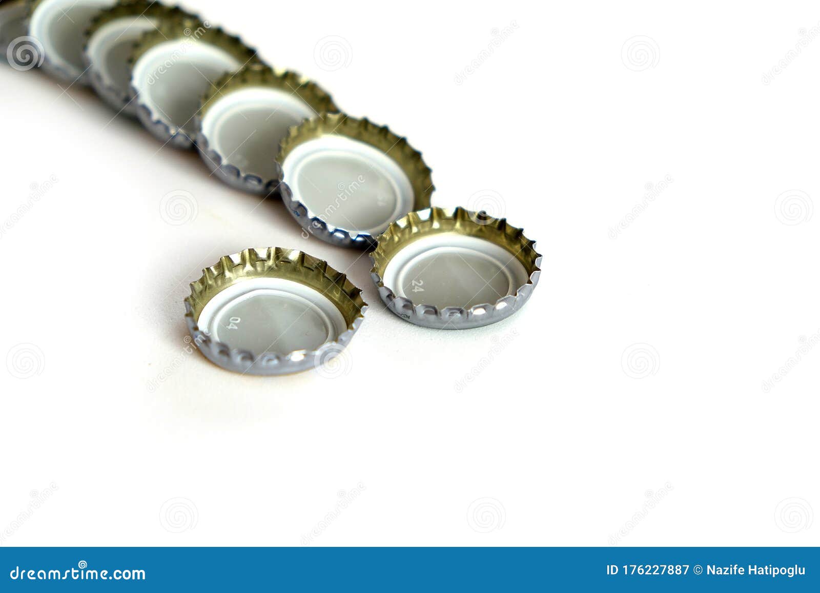 Coke and Soda Lid on White Floor, Many Soda Bottle Caps Stock Image