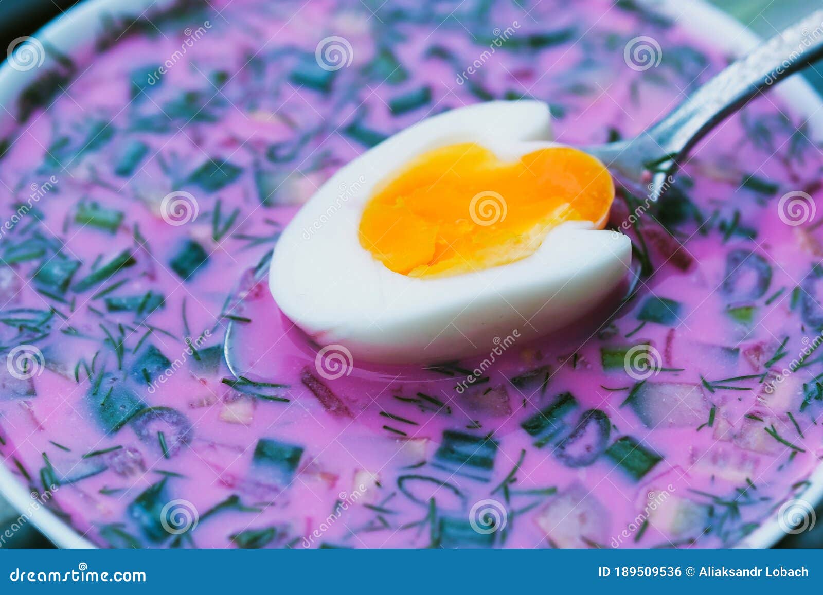 cold beetroot soup with eggs and bread on a decorative tray.soup kholodnik red on an unusual tray. food