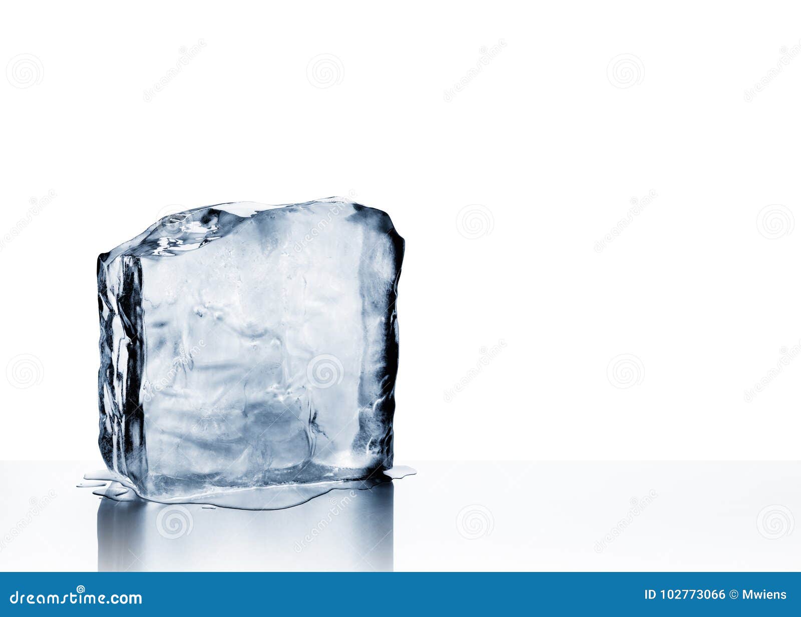 cold clear frozen block of ice melting on white