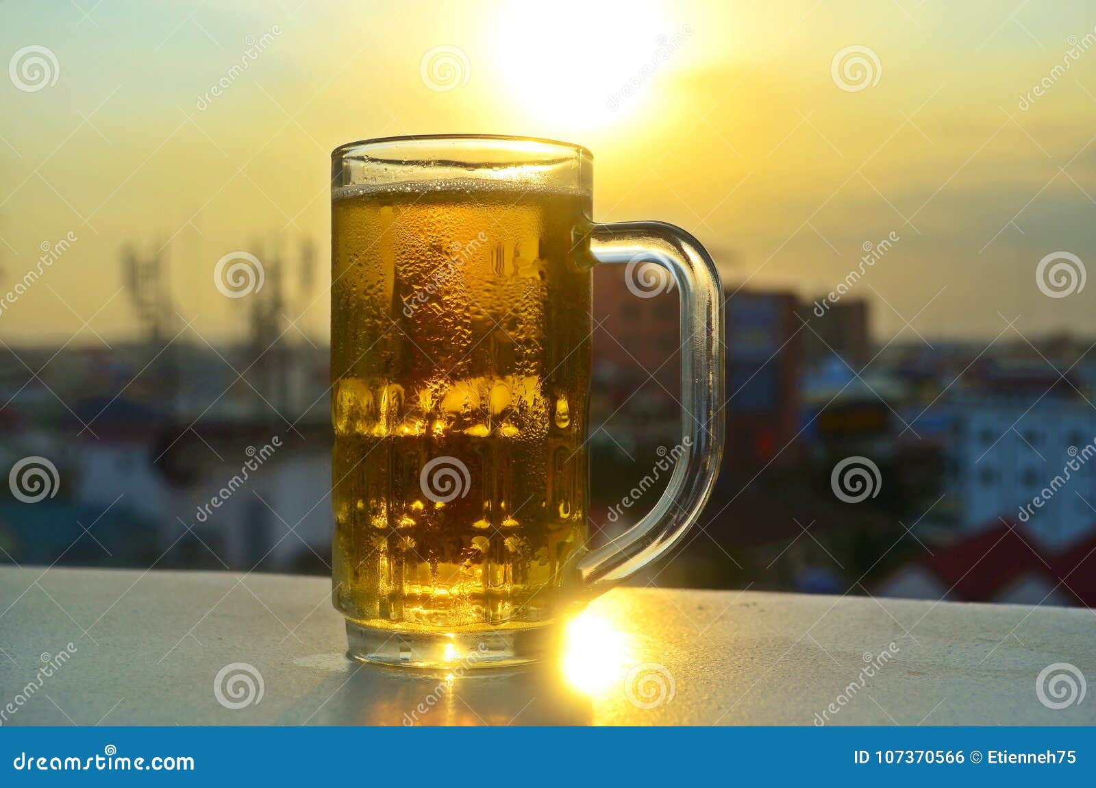 A Glass of Beer in the Sun. Stock Photo Image of golden, celebration 107370566