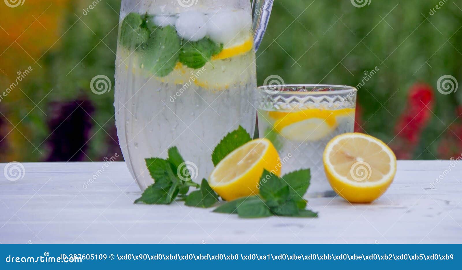 Cold Lemonade with Fresh Lemon and Crushed Ice Cubes. Selective Focus