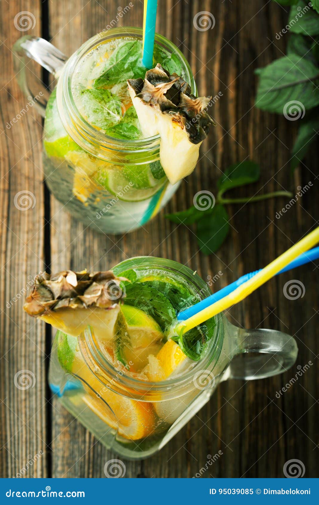 Cold Lemonade with Soda Water, Mint, Orange and Lemon in a Jar Stock