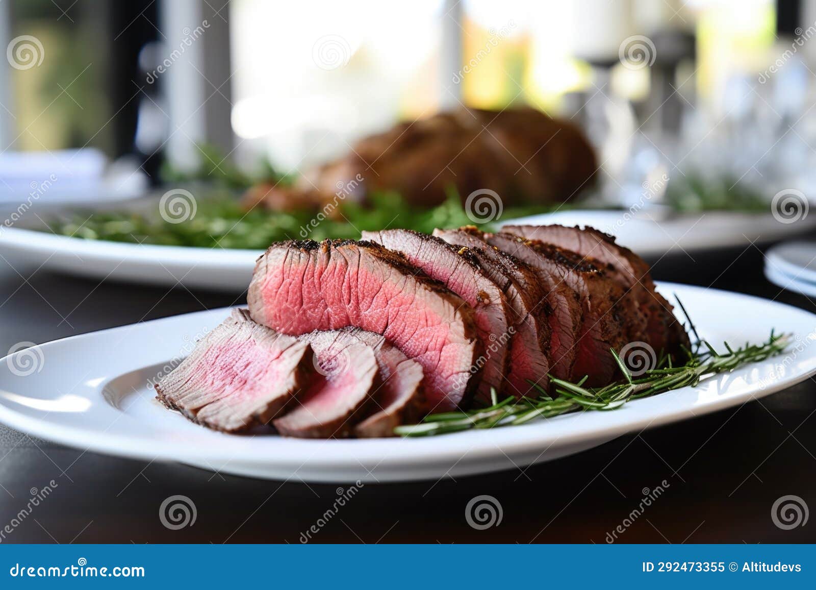 Cold Roast Beef Sliced and Placed on a Plain White Plate Stock Image