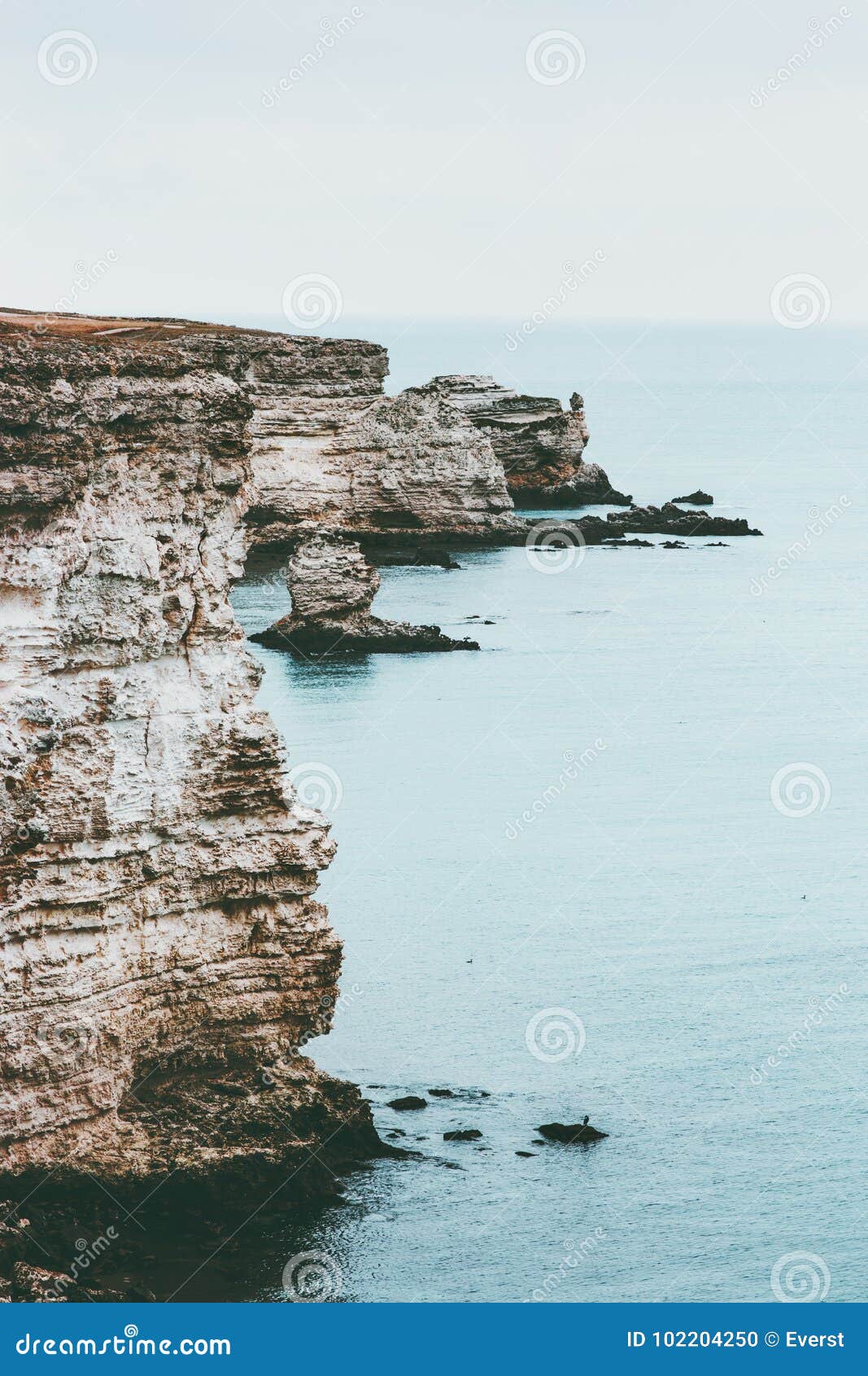 cold sea with rocky seaside landscape calm and tranquility scenic