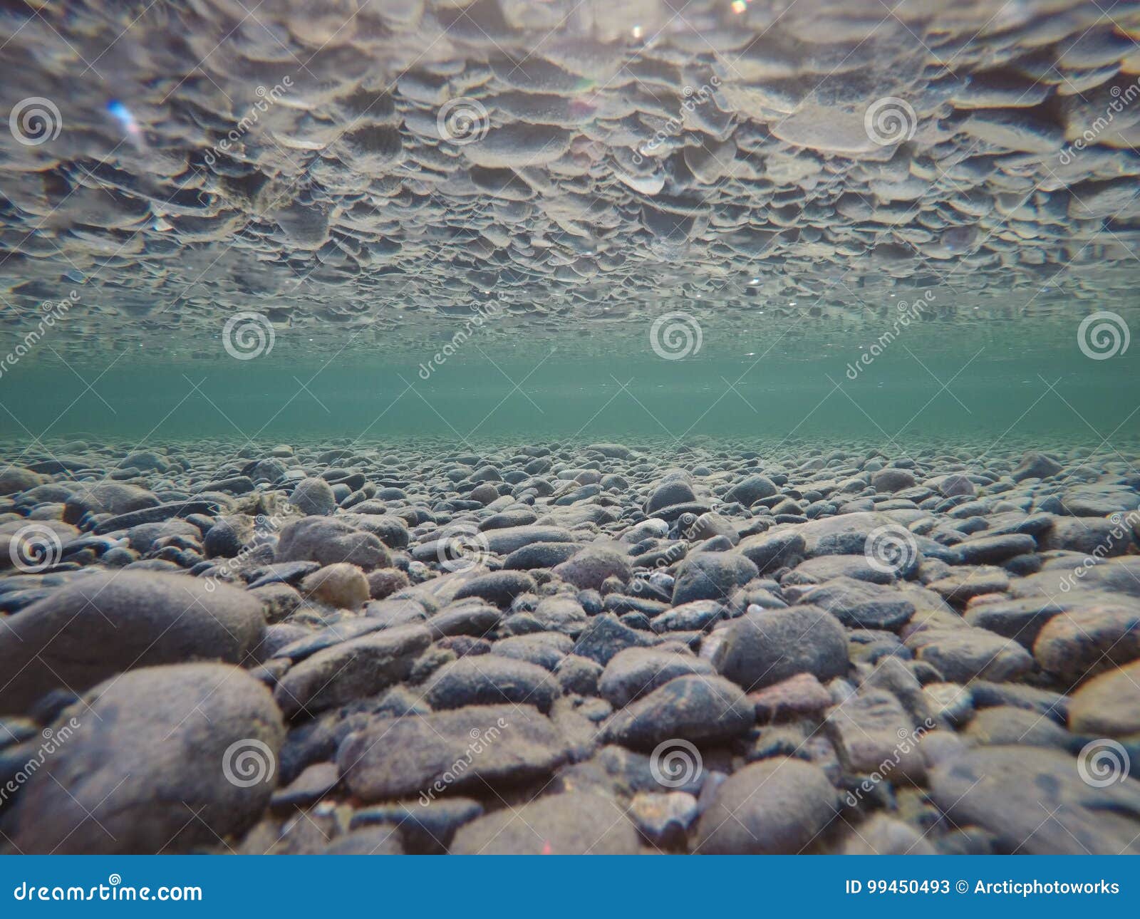 Cold Underwater River Bed with Perfect Reflection on Surface Tension