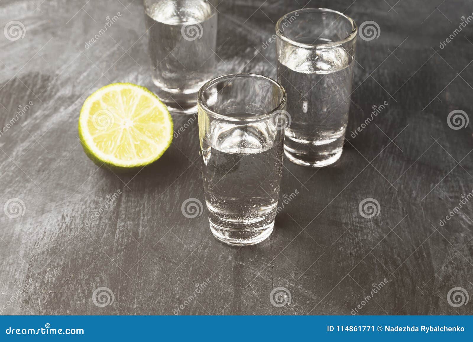 Cold Vodka In Shot Glasses On A Black Background. Toned Stock Image