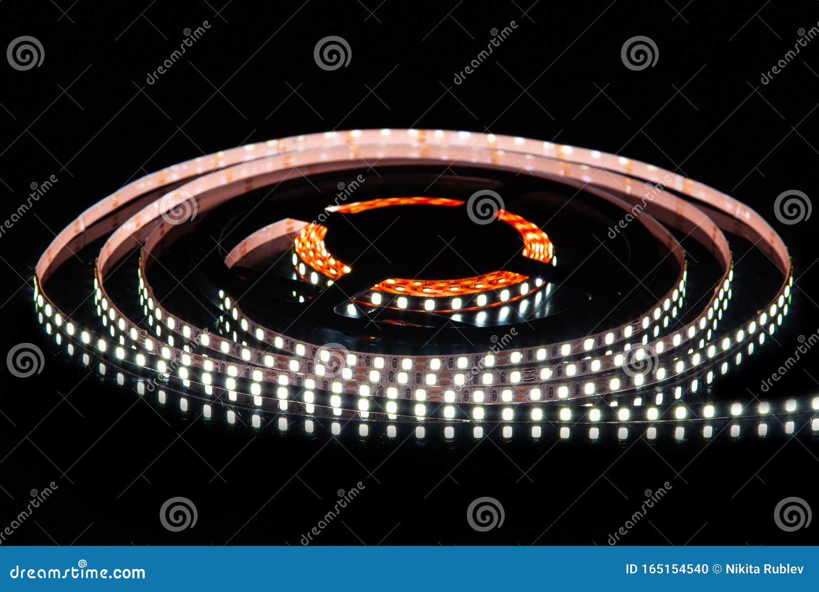 cold white led strip on reel with black background